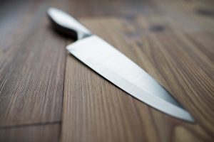 Kitchen knife on wooden table