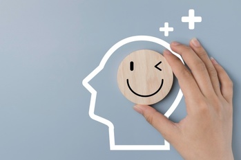 Happy smile relax face in wooden lable and positive thinking . 