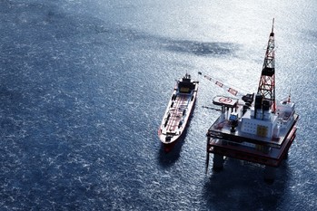 Oil platform on the ocean. Offshore drilling for gas and petroleum