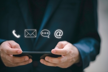 Businessman using Smart Phone with the email, call phone, address, Chat message icons