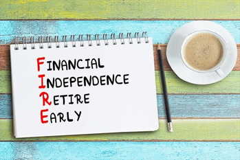 FIRE acronym - financial independence, retire early, handwriting in a notebook