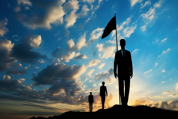 Silhouette of a businessman with a flag against a dynamic sky