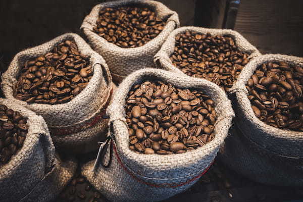 Coffee beans in bags. Fresh coffee beans background.