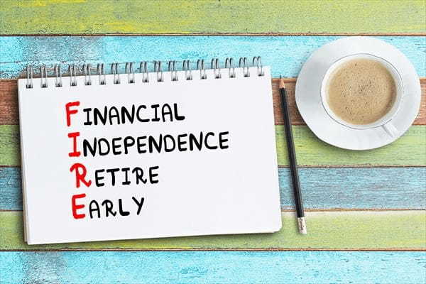 FIRE acronym - financial independence, retire early, handwriting in a notebook