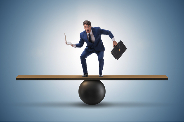 https://www.shutterstock.com/image-photo/businessman-trying-balance-on-ball-seesaw-789433873